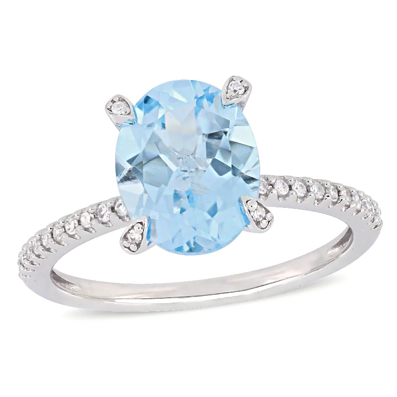 Miadora 3 4/5ct TGW Oval-Cut Sky Blue Topaz and 1/10ct TW Diamond Ring in 10k White Gold